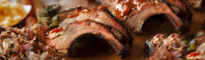 Close up Image of smoked bbq ribs to illustrate Ludington MI BBQ, The Q Smokehouse