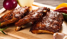 Image of smoked bbq spare ribs to illustrate southern style smoked meats at Ludington MI BBQ, the Q SmokeHouse